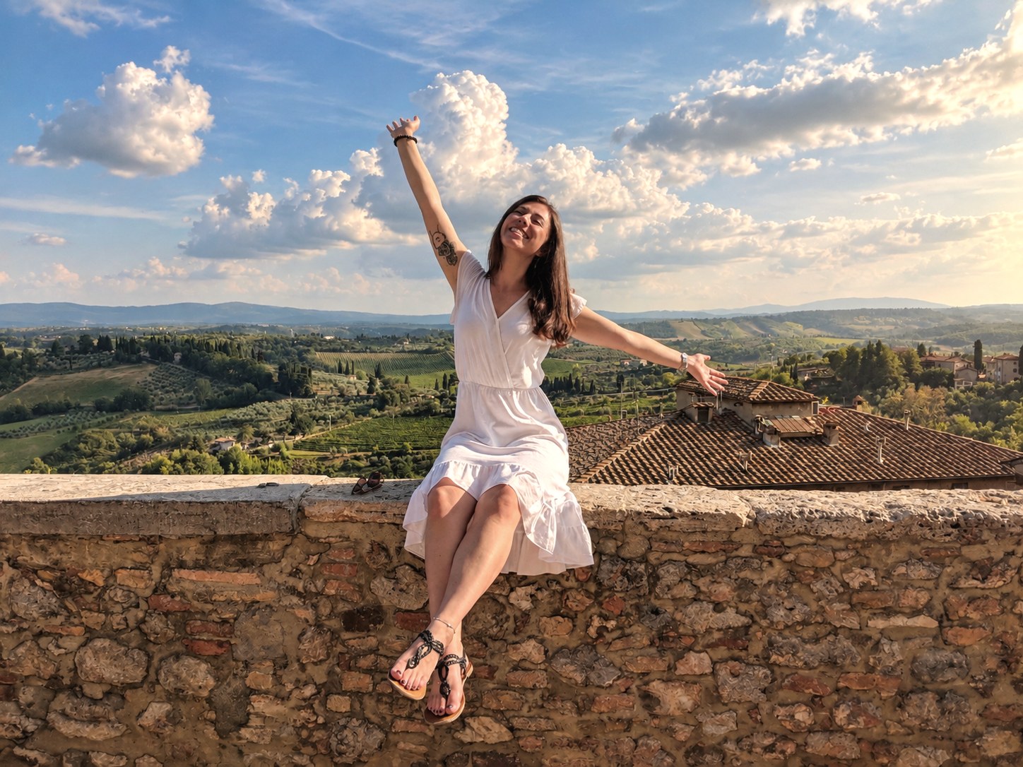 Arms wide over the Tuscan hills