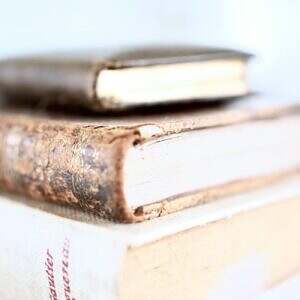 stack of thick books on table